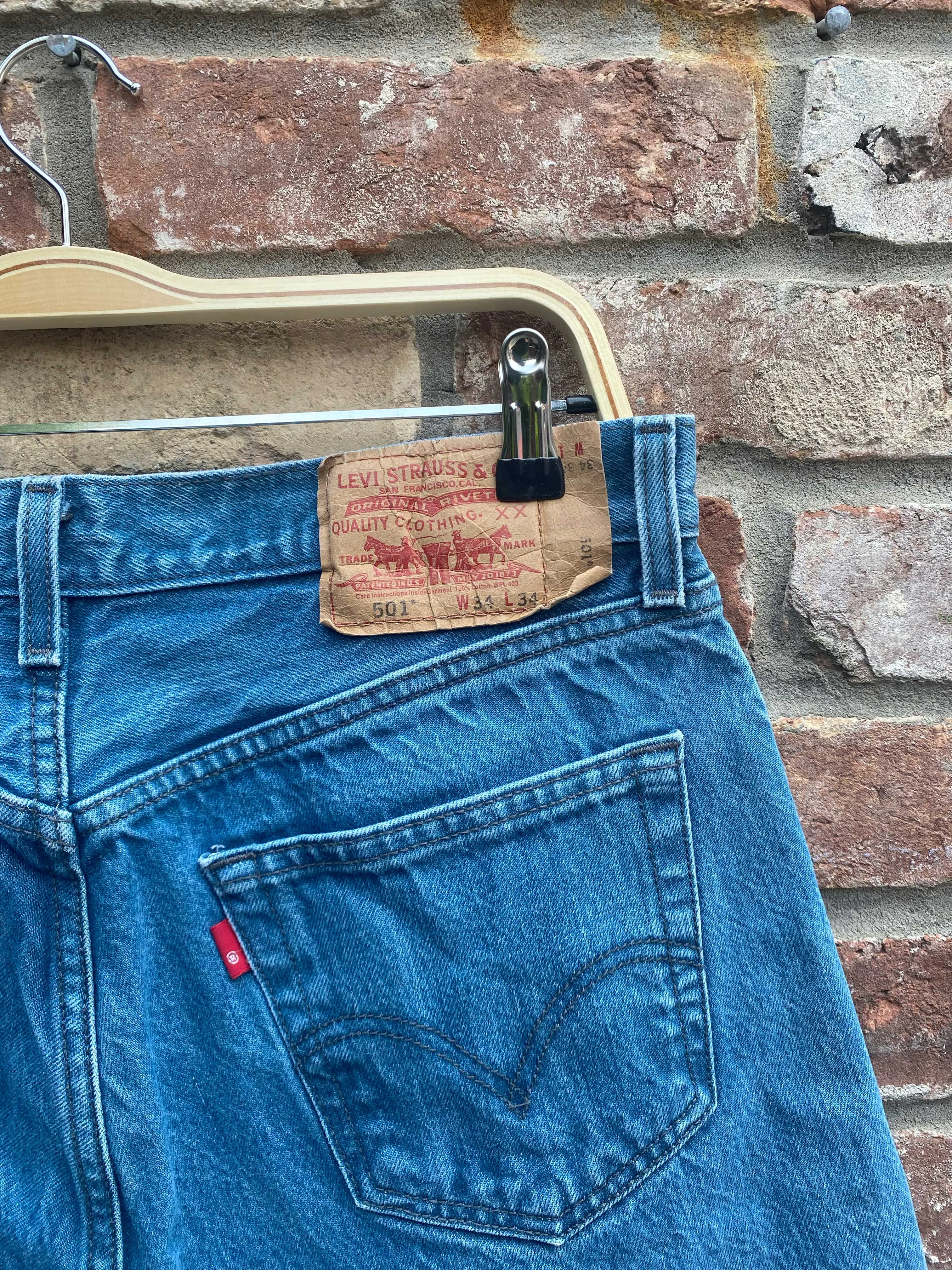 vintage levi's 501 long denim shorts sold by Good Market Thrift Store