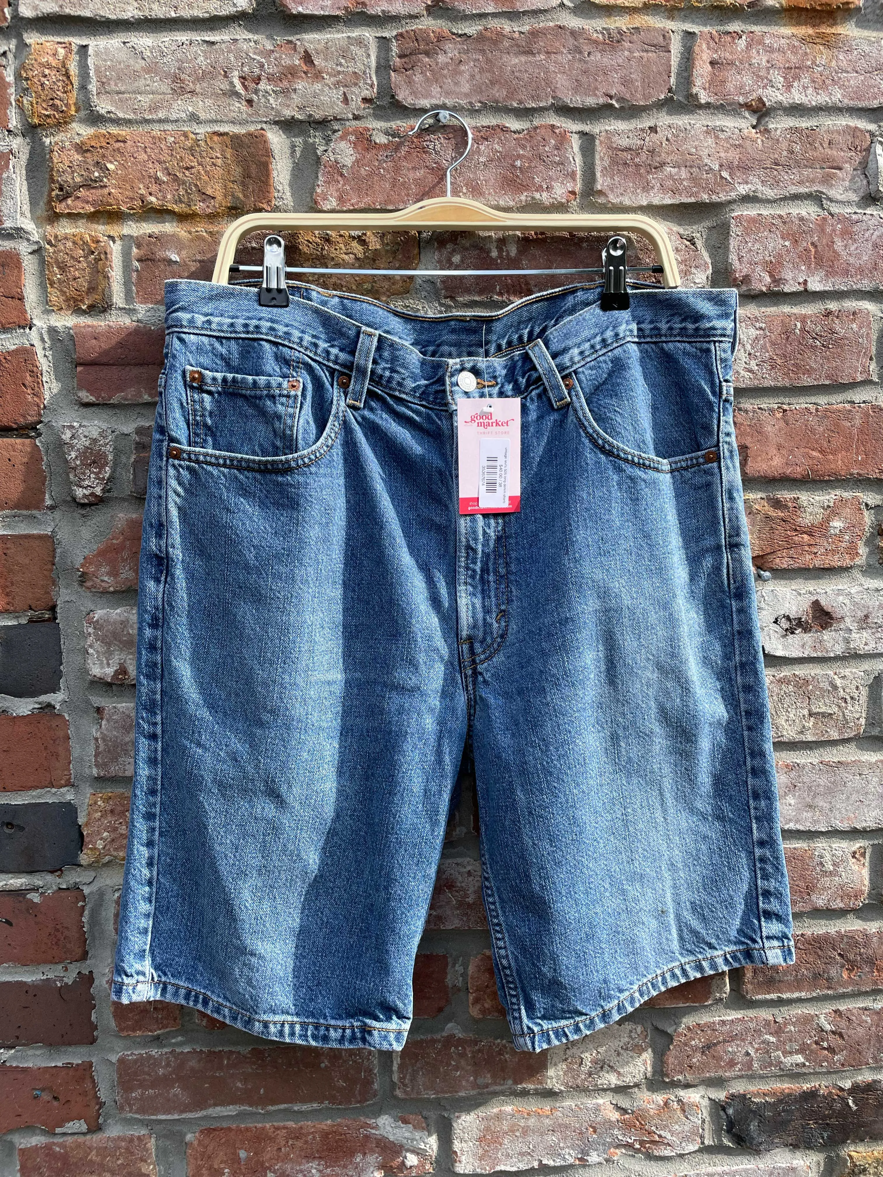 vintage levi's 505 long denim shorts sold by Good Market Thrift Store