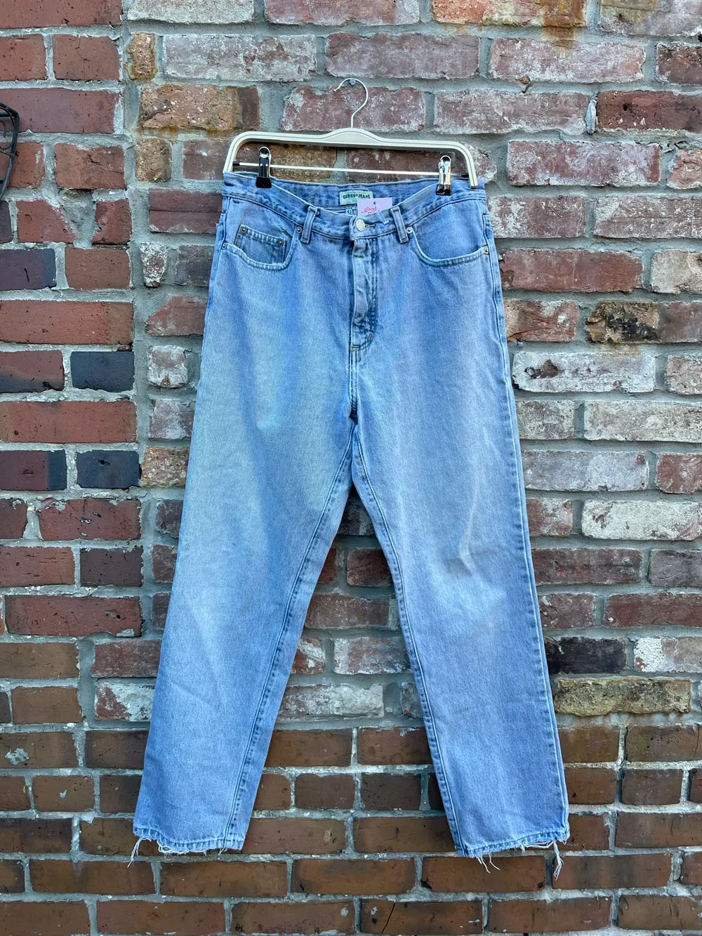 vintage 90s guess light wash jeans sold by Good Market Thrift Store product image thumbnail 3