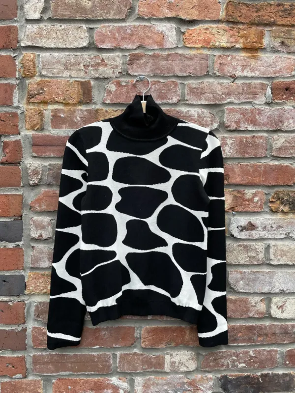 pink tartan abstract animal print turtleneck sold by Good Market Thrift Store