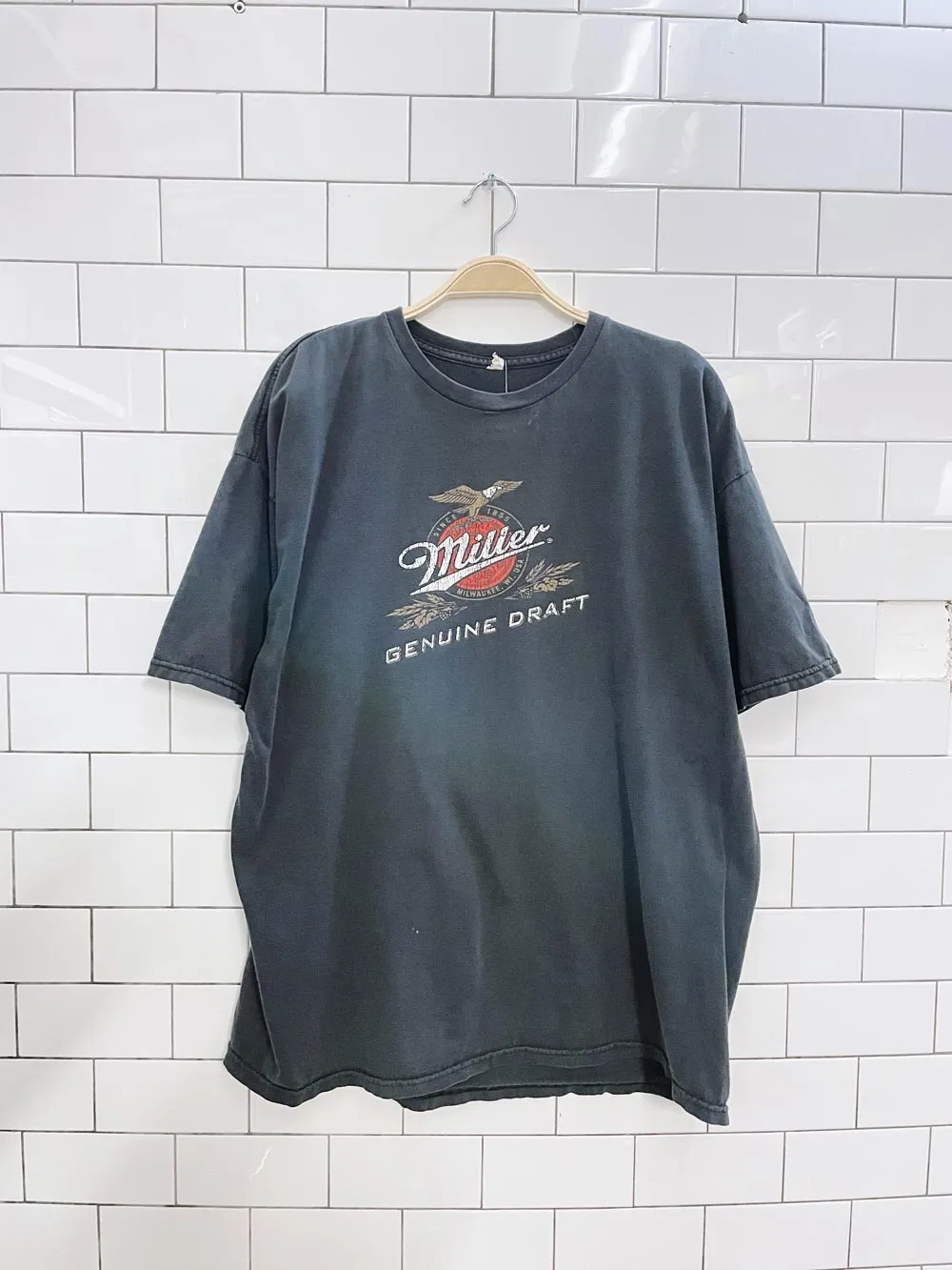 vintage 00s miller x raptors graphic tee sold by Good Market Thrift Store