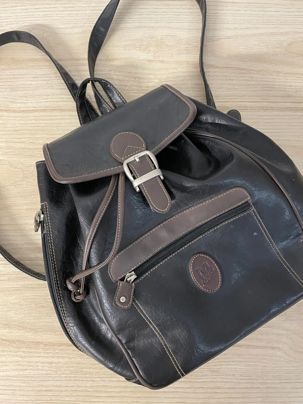 vintage 90s mouflon faux leather backpack sold by Good Market Thrift Store