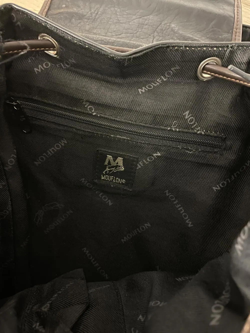 vintage 90s mouflon faux leather backpack sold by Good Market Thrift Store product image thumbnail 5