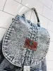 vintage 80s liz thomas acid wash denim backpack sold by Good Market Thrift Store