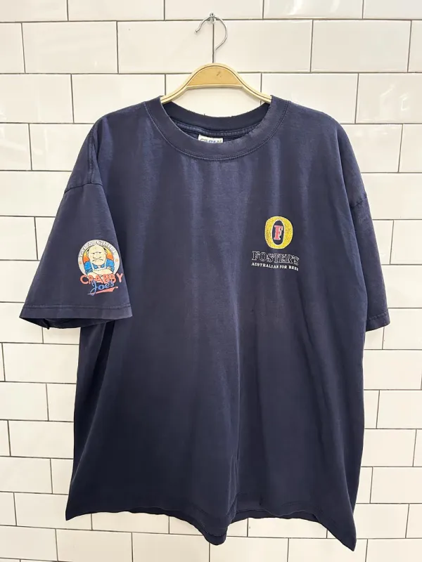 vintage 00s fosters beer x sydney olympics tee sold by Good Market Thrift Store