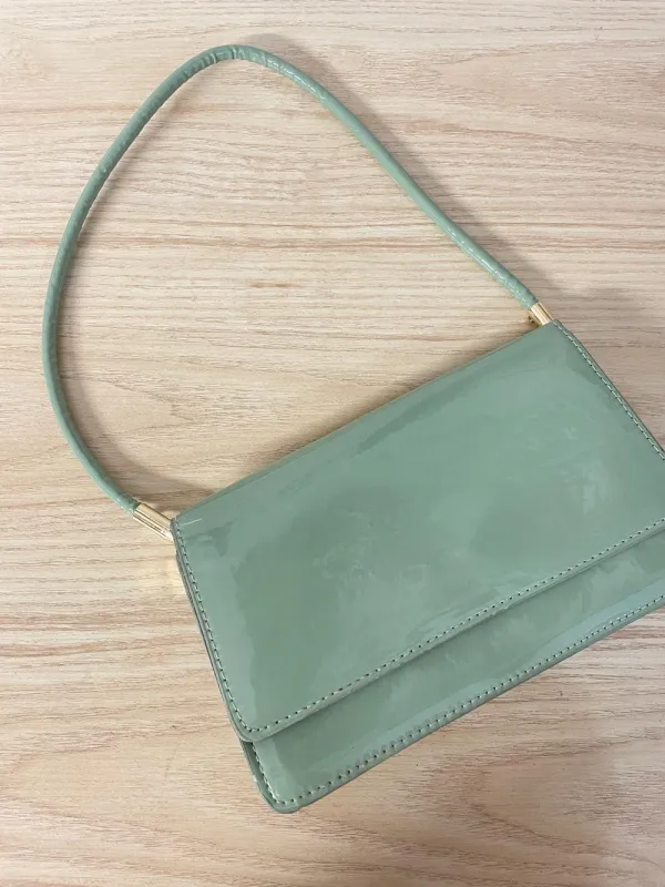 patent mint green shoulder bag sold by Good Market Thrift Store