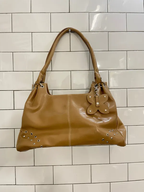 y2k kgb faux leather shoulder bag w flower charm sold by Good Market Thrift Store