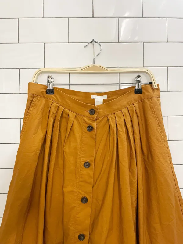 h&m goldenrod full button midi skirt sold by Good Market Thrift Store
