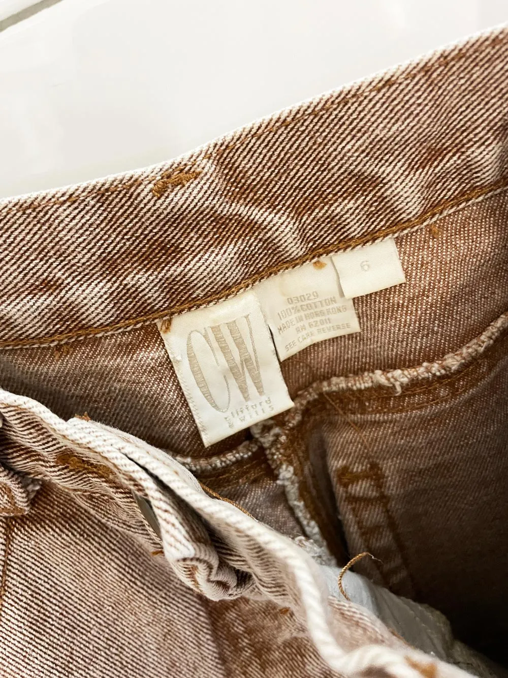 vintage 90s cw brown high rise raw hem tapered jeans sold by Good Market Thrift Store product image thumbnail 2