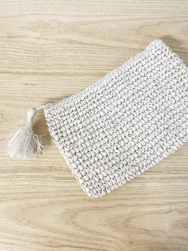 straw summer clutch with tassel zipper sold by Good Market Thrift Store