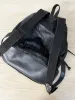 vintage 90s grunge leather patchwork backpack sold by Good Market Thrift Store