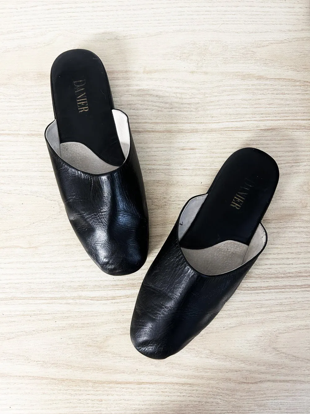 danier minimal leather slip on mules sold by Good Market Thrift Store
