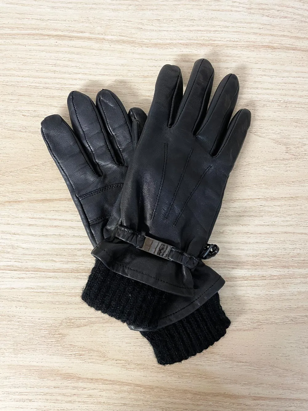 danier lambskin knit lined leather gloves sold by Good Market Thrift Store