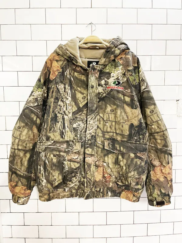 mossy oak camo hooded puffer bomber jacket sold by Good Market Thrift Store