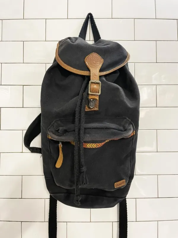 vintage 90s roots leather trim canvas backpack sold by Good Market Thrift Store