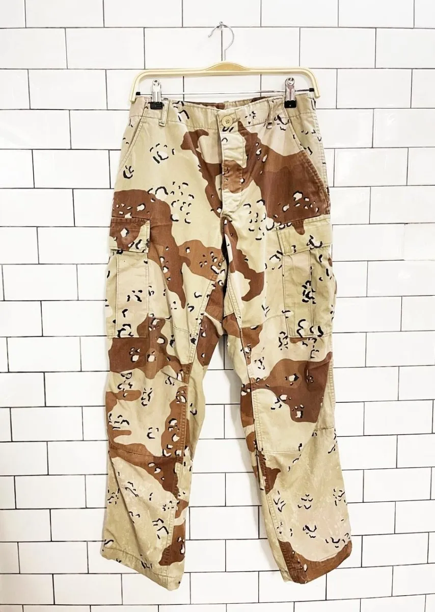 vintage 90s army desert camo cargo pants sold by Good Market Thrift Store