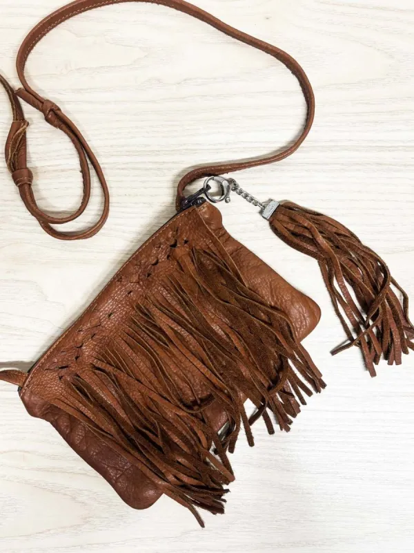 hides in hand fringe leather crossbody bag + tassel charm made by Good Market Thrift Store