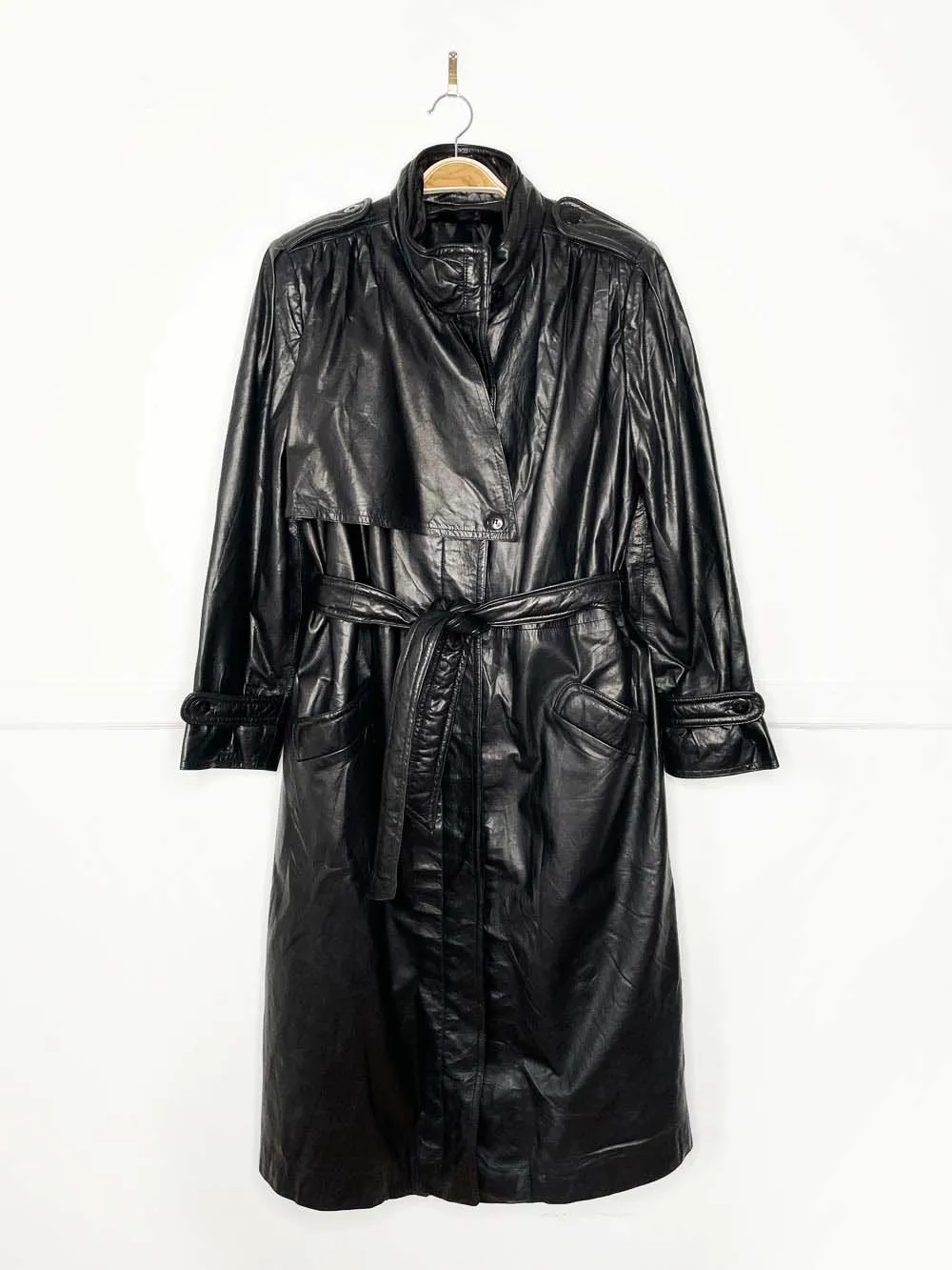 vintage butter leather pleated strong shoulder belted trench coat sold by Good Market Thrift Store