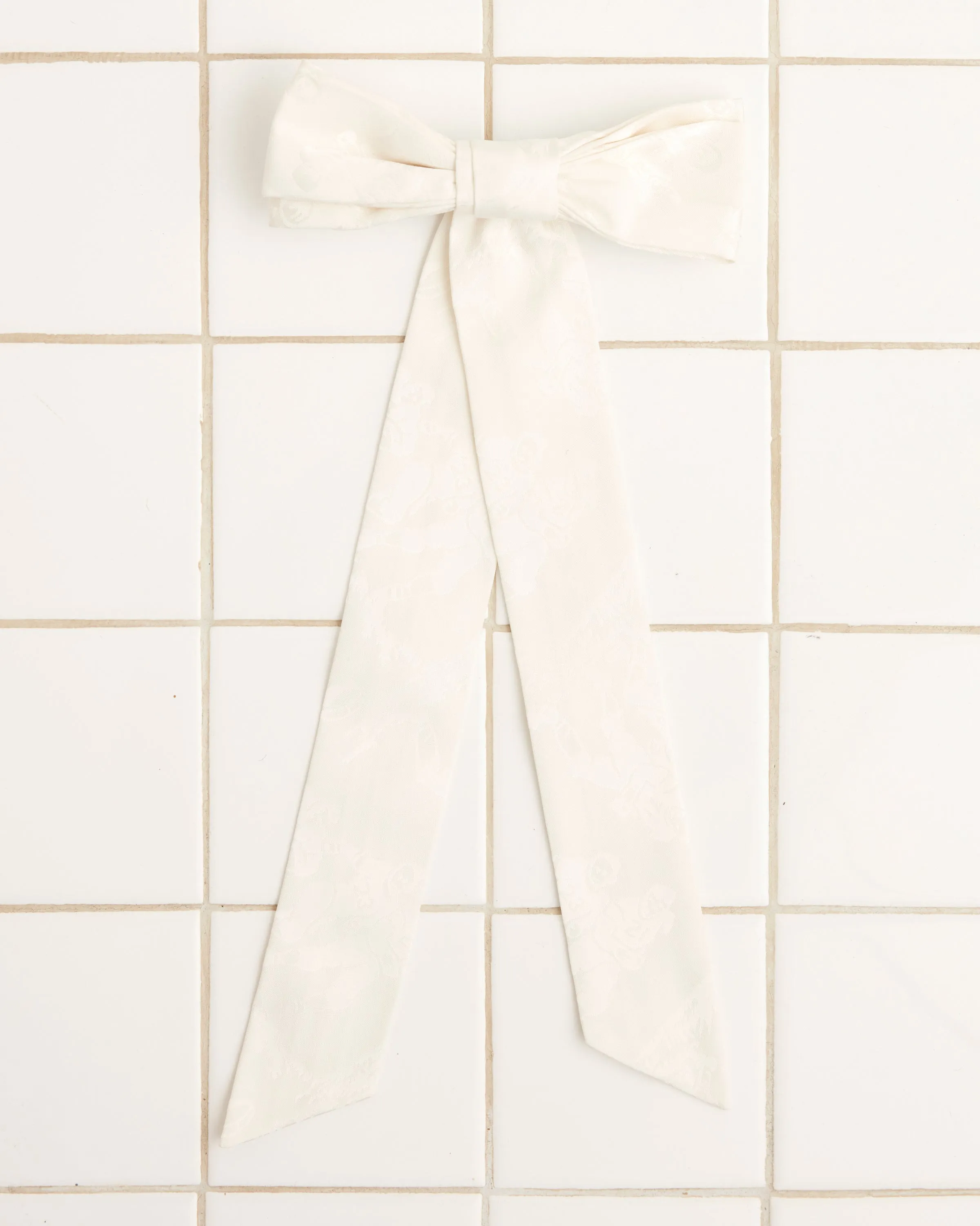 Football Jacquard Bow Barrette - Cream sold by BODE