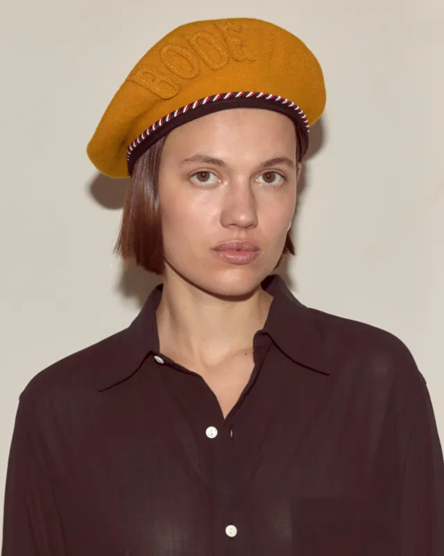 Script Beret - Gold with Red/Blue Piping sold by BODE