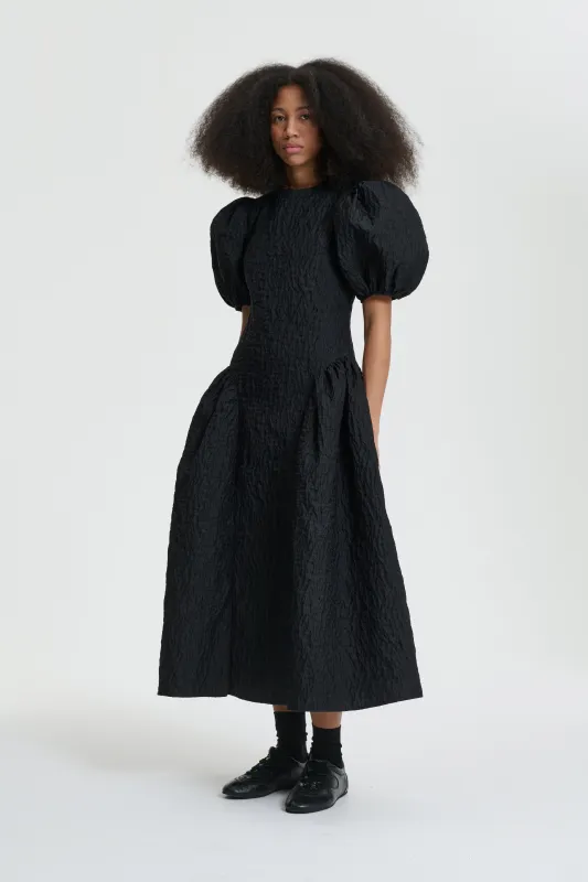 BALI | DRESS LOBELIA MATELASSÉ BLACK sold by Cecilie Bahnsen