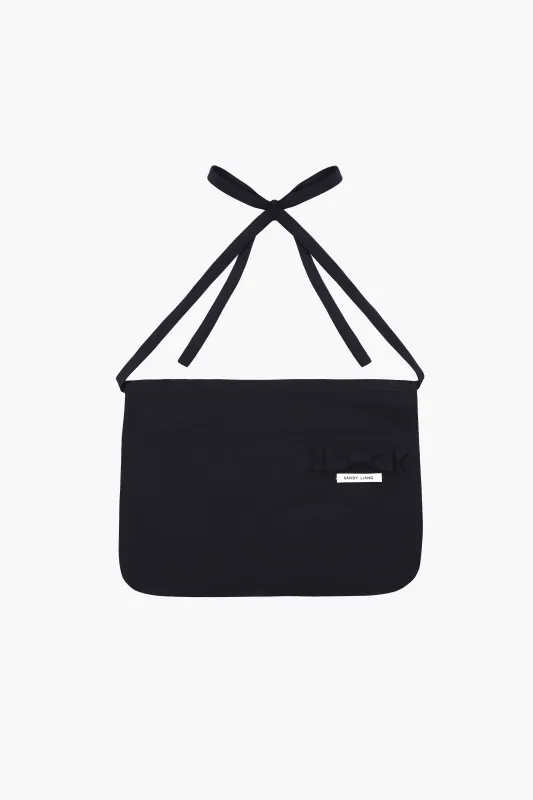 KIKI APRON IN NAVY made by Sandy Liang