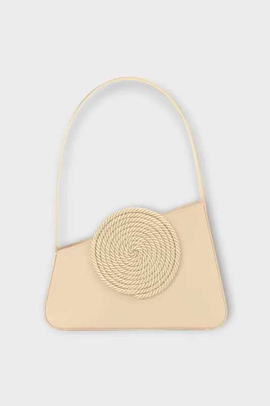 Beige asymmetric leather bag with passementerie detaiils sold by DESTREE