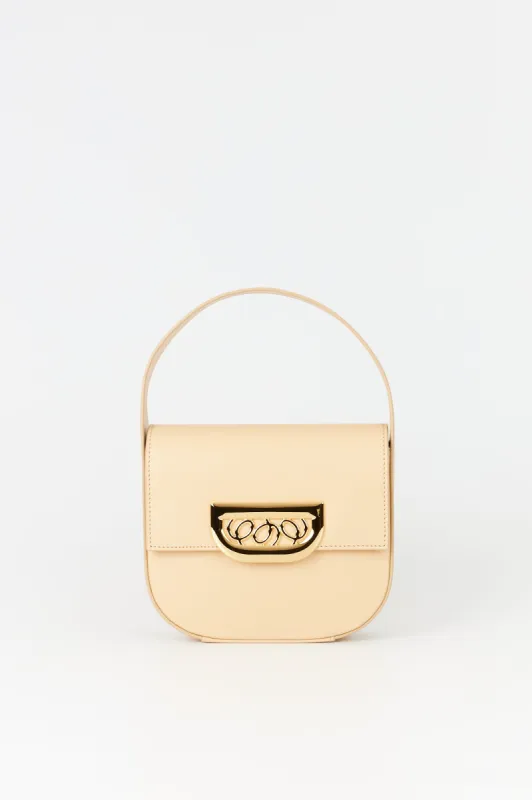 Beige leather handbag with golden latch made by DESTREE