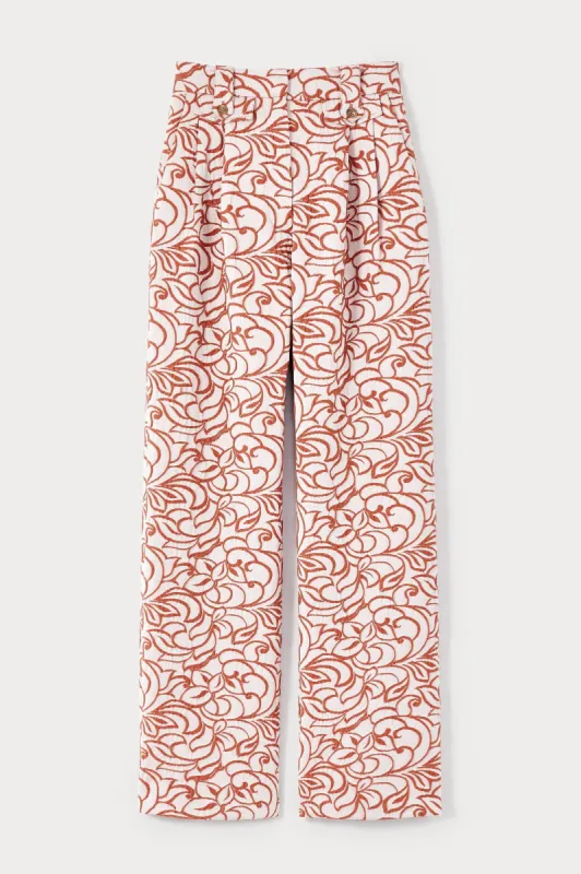 Ecru and orange high-waisted jacquard print trousers sold by DESTREE