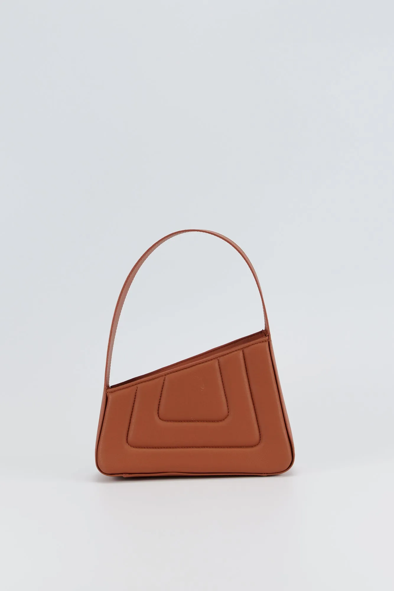 RUST Asymmetric Leather Quilted Mini Bag sold by DESTREE