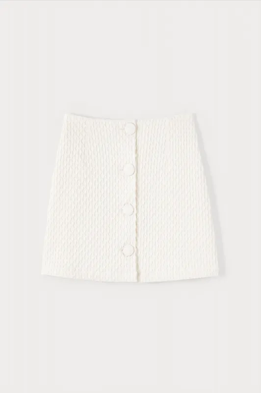 Ecru textured mini skirt with buttons sold by DESTREE