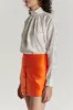 Orange satin mini skirt with buttons sold by DESTREE