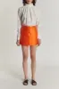 Orange satin mini skirt with buttons sold by DESTREE
