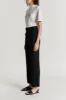 Black flared pants with circular pocket detail sold by DESTREE