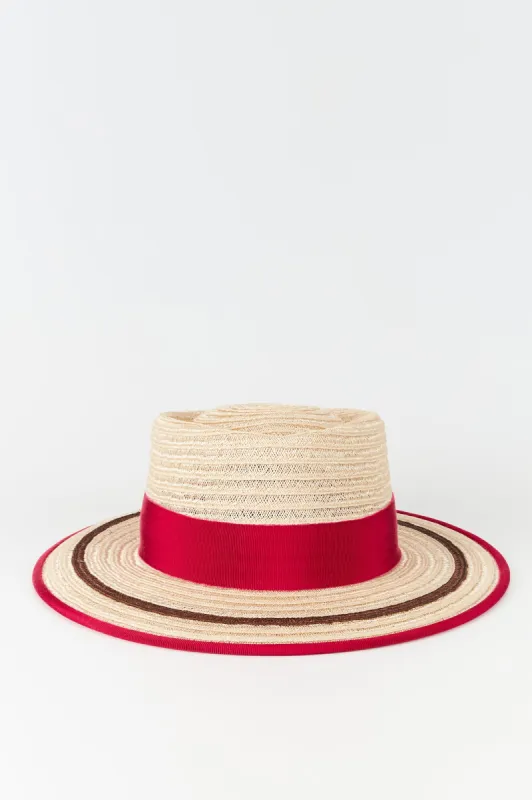 Natural straw wide-brim hat with fuschia band made by DESTREE