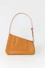 Tabacco asymmetric leather quilted bag sold by DESTREE