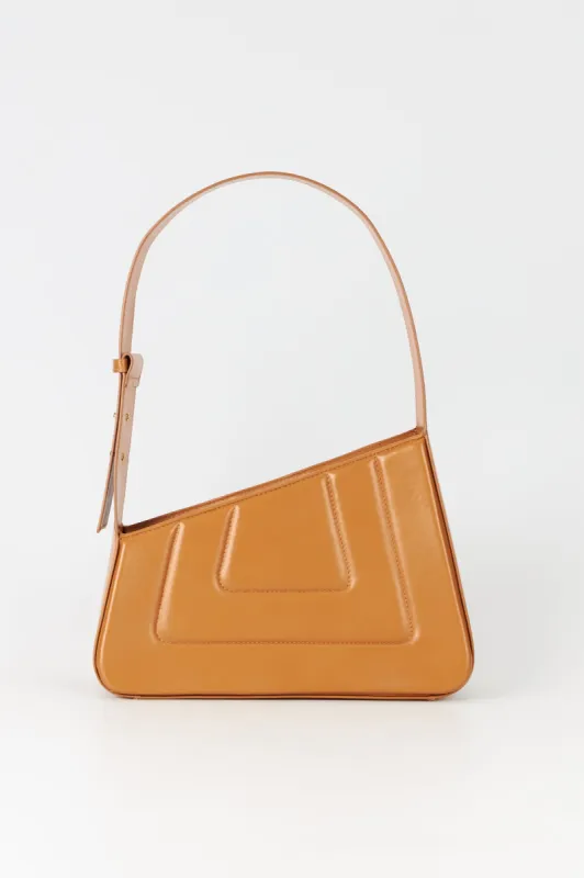 Tabacco asymmetric leather quilted bag sold by DESTREE