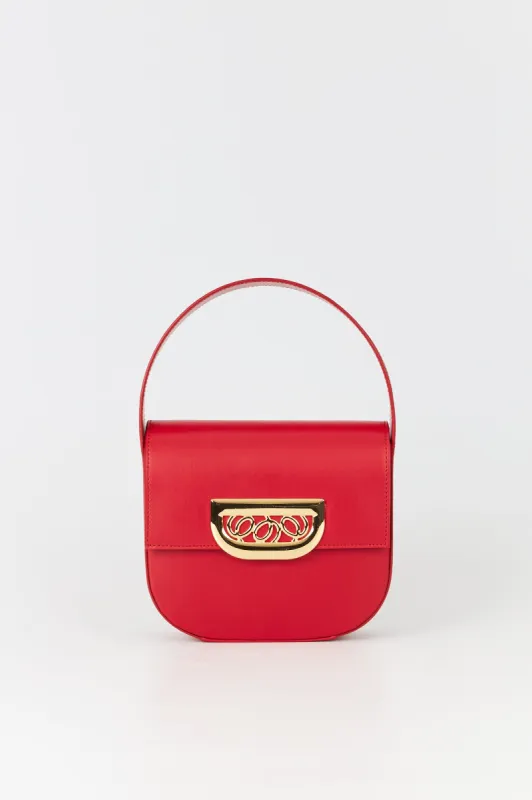 Bright red leather handbag with golden latch made by DESTREE