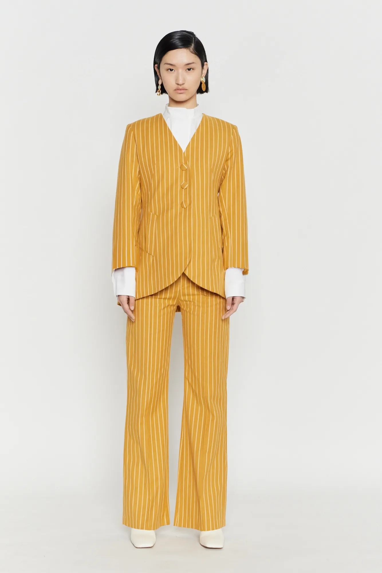 Mustard striped fitted long blazer sold by DESTREE
