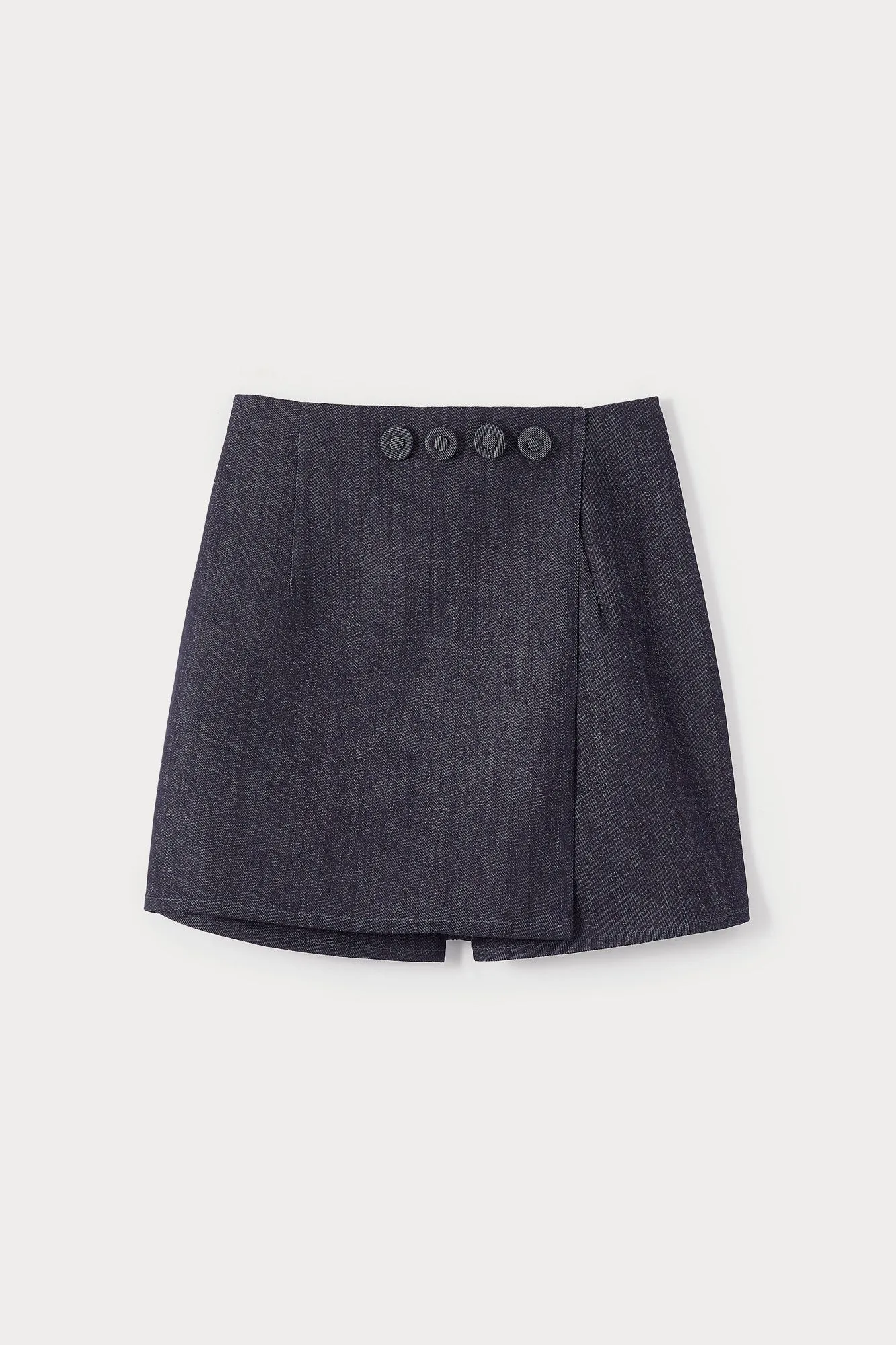 Dark denim skirt with button detail sold by DESTREE