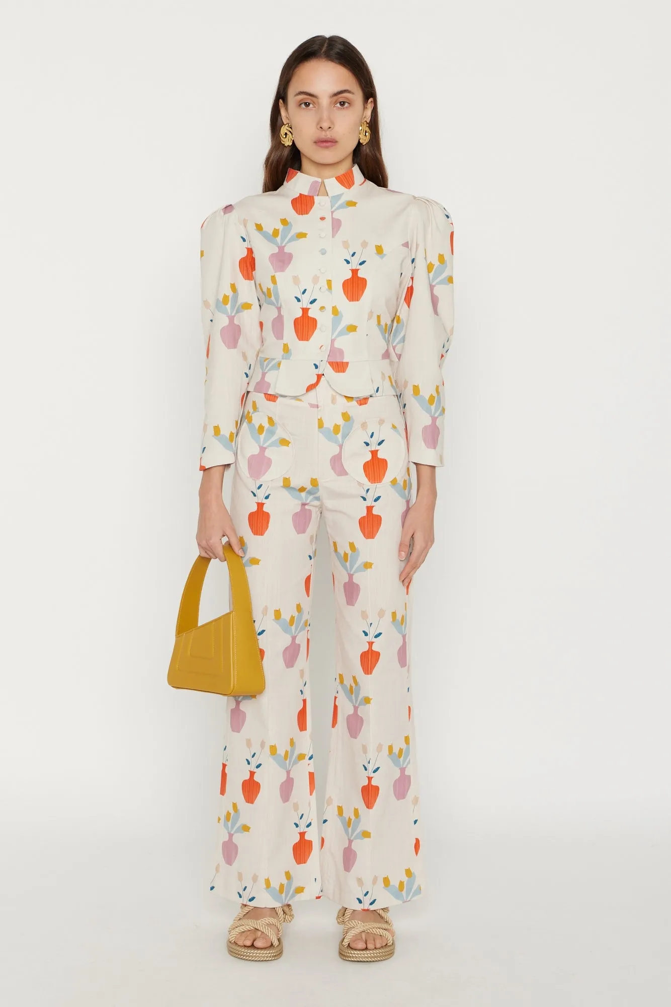 Mustard asymmetric leather quilted mini bag sold by DESTREE