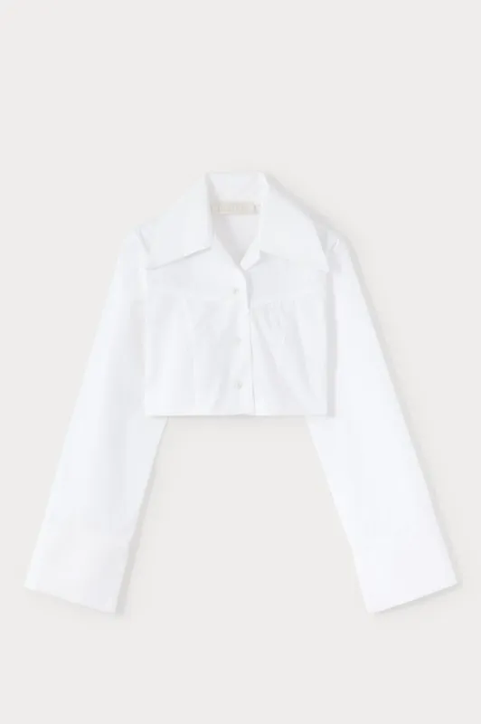 White popelin cropped shirt with wide collar and extended cuffs sold by DESTREE