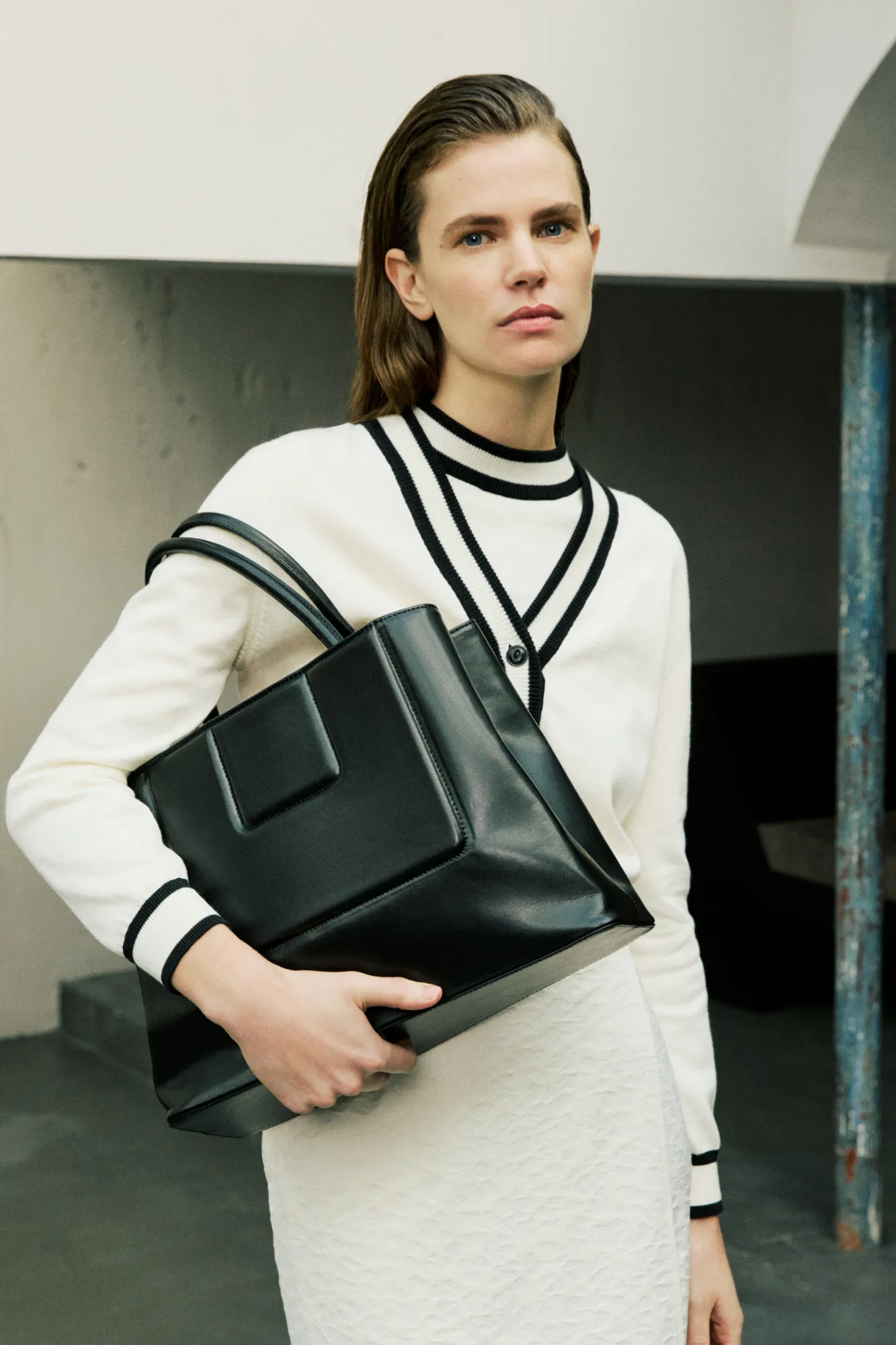 Black structured leather tote sold by DESTREE