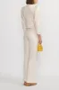 Denim ecru flared pants with circular pocket details sold by DESTREE