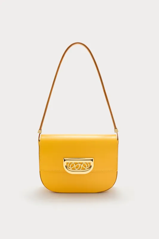 Yellow leather crossbody bag with golden clasp sold by DESTREE