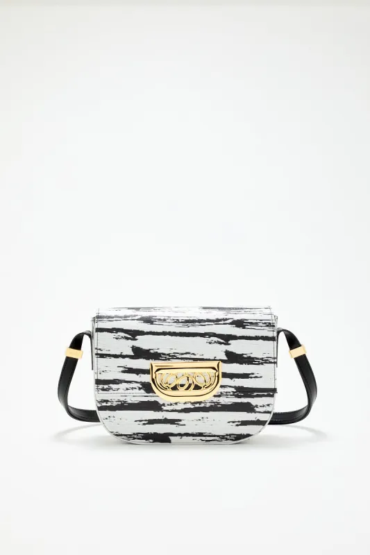 Geometric brush black bag with golden clasp sold by DESTREE