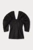 Black textured top with structured sleeves sold by DESTREE
