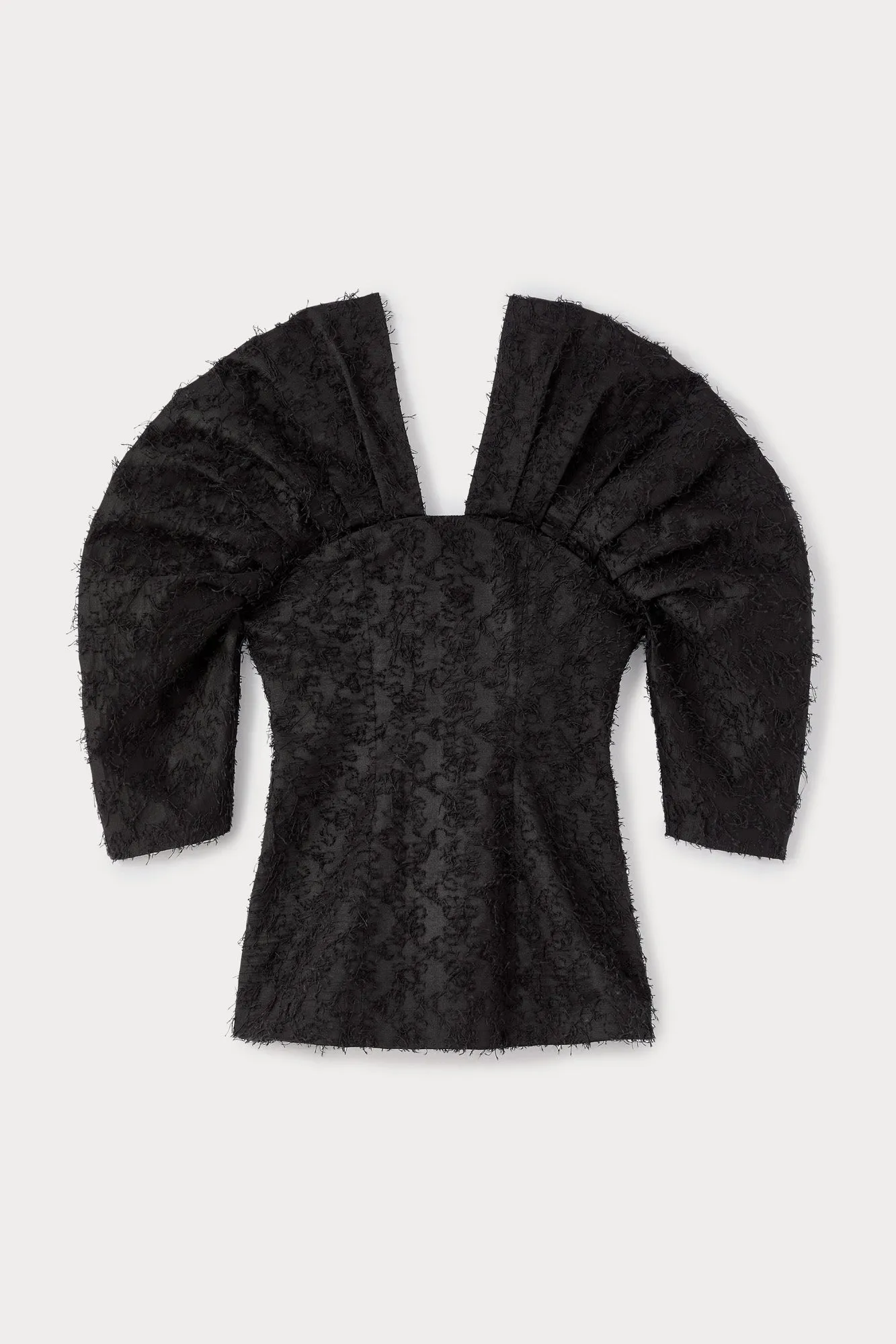 Black textured top with structured sleeves sold by DESTREE