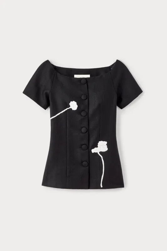 Black virgin wool top with floral embroidery sold by DESTREE
