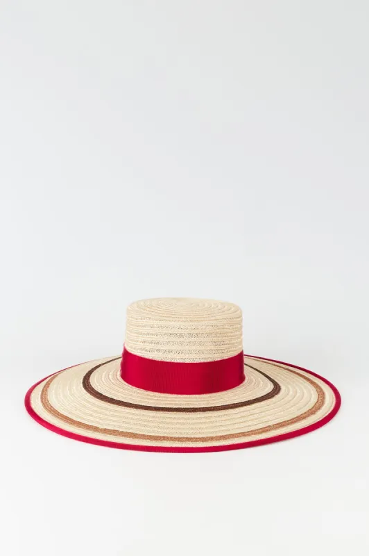 Natural straw hat with fuchsia striped band made by Annie